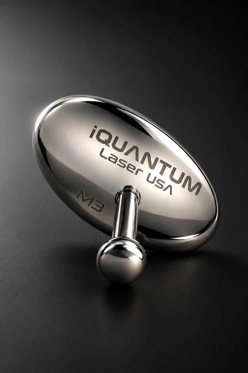 iQUANTUM SHIELD mirror-polished stainless steel eye shield on a dark background